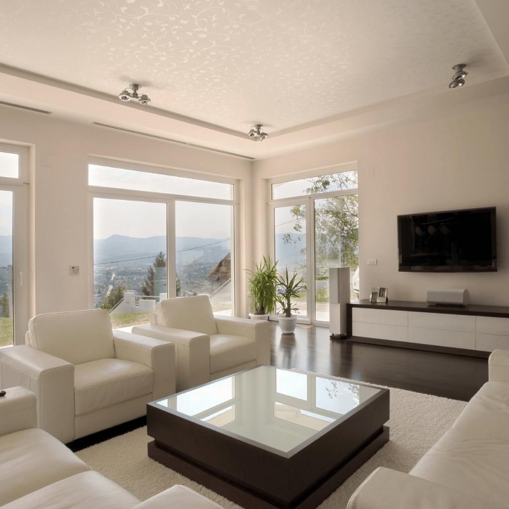 french sliding patio doors in a white modern living room with white seating areas