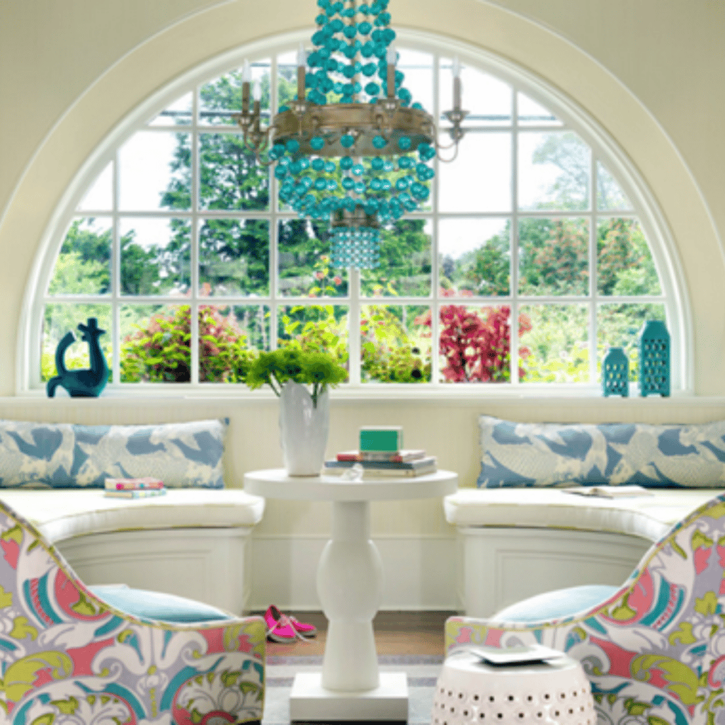 round top window in a sitting area with a lot of colors for decoration