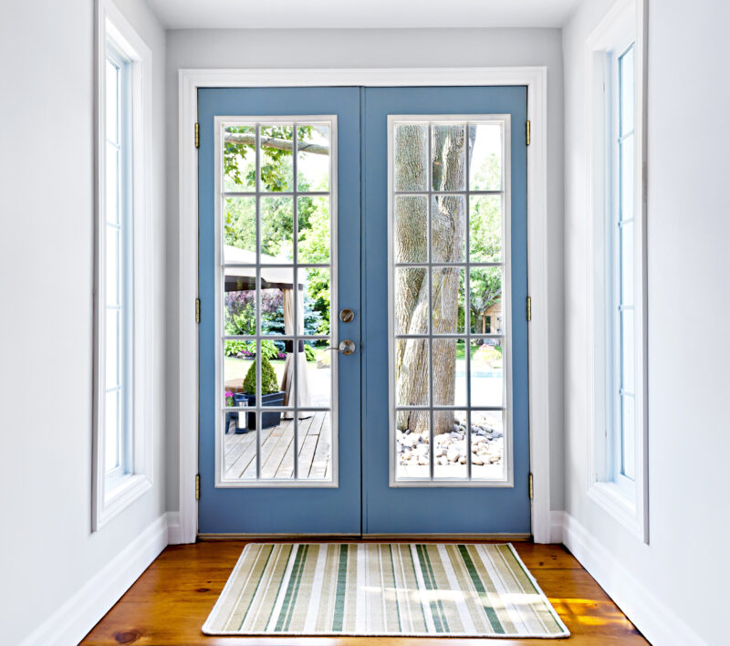 french doors to a backyard
