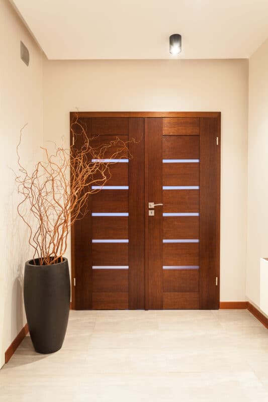 wooden entry door to a home