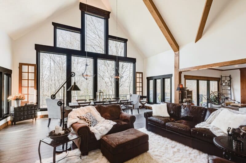 picture windows in a living room. View of the backyard